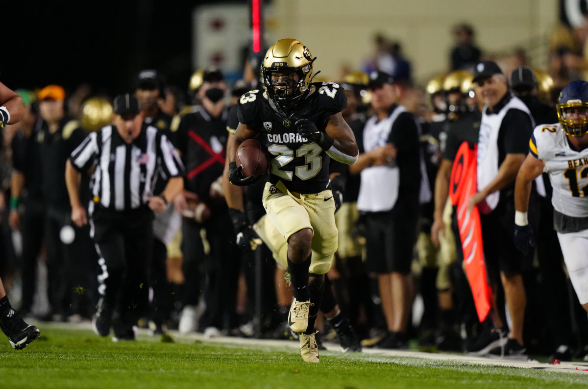 Colorado running back Jared Broussard (23) sprints along the sideline against Northern Colorado.